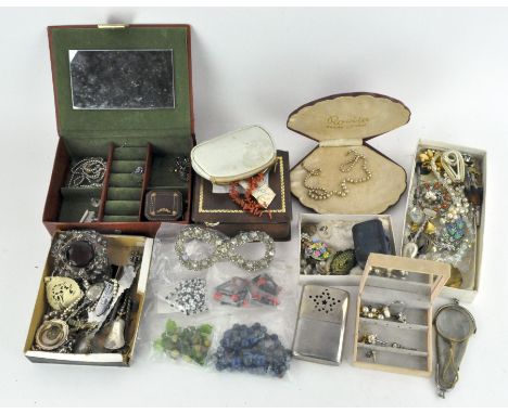 A large assortment of costume jewellery, including a coral necklace, pearls, hat pins, brooches, necklaces, beads and more