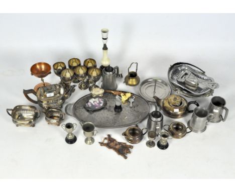 An assortment of silver plated and metal wares, to include a three piece tea set, goblets, Ronson table lighter and more