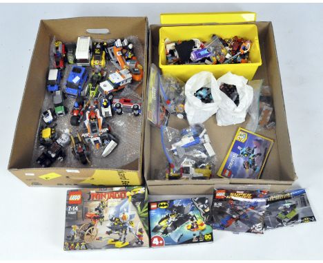 A large collection of Lego vehicle sets, many premade, a boxed Batman #76158, Ninjago #70629 and a large box of loose lego in