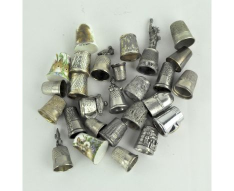 A collection of 20th Century novelty and souvenir thimbles, modelled as historic monuments, two Goebel Hummel enamel thimbles
