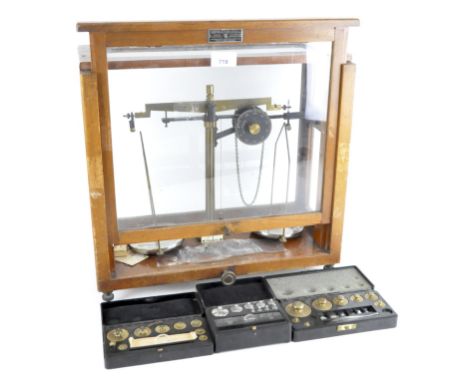 Set of Griffin &amp; Tatlock Ltd weighing scales with three sets of cased weights, early 20th century, in glazed oak case, 39