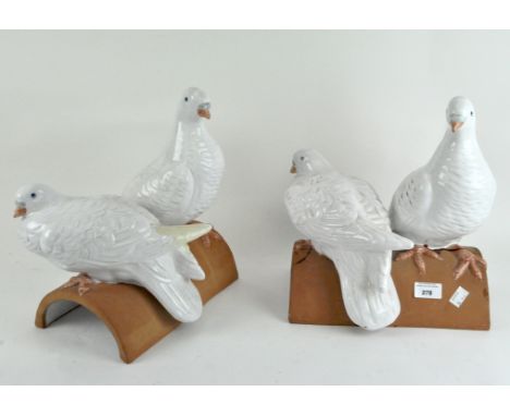 Two pairs of white ceramic doves, mounted on roof tiles, marked to underside made in Italy