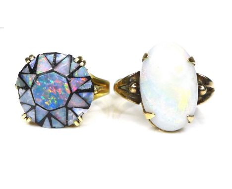 Two opal rings, comprising of an 18ct gold and oval cut opal ring, opal, 9 by 15mm, size O, 4.7g, together with a 14ct gold b