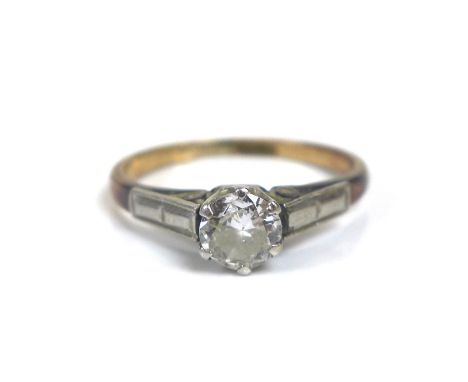 A 18ct gold diamond solitaire ring, the round cut diamond 4mm diameter, with illusion set shoulders, size H/I, 1.9g. 