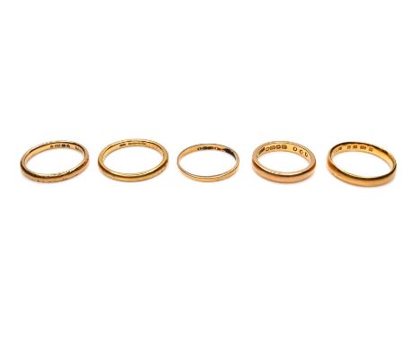 A group of five 22ct yellow gold wedding band rings, comprising one 2.1mm wide, size L/M, 2.9g, one 3.0mm wide, size L, 3.4g,