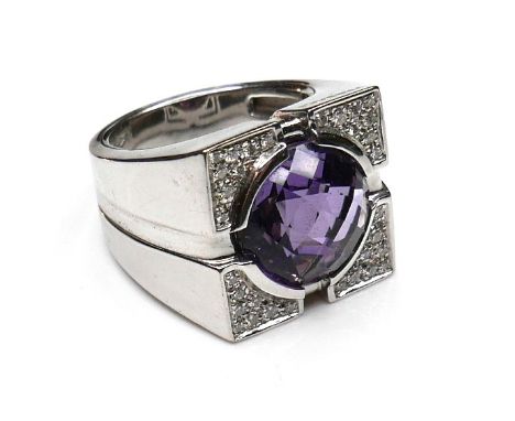 A Versace 18ct white gold ring, set with a circular faceted cut amethyst, 13.5 by 7.5mm, within diamond pave set corners, siz