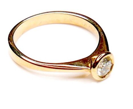 An 18ct yellow gold and diamond solitaire ring, the round brilliant cut stone approximately 4.0 by 2.5mm, 0.25ct, size L, 2.8