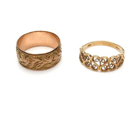 Two 9ct gold rings, one a Victorian 9ct yellow gold band with a relief foliate design, 8.5mm wide, Edward Vaughton, Chester 1