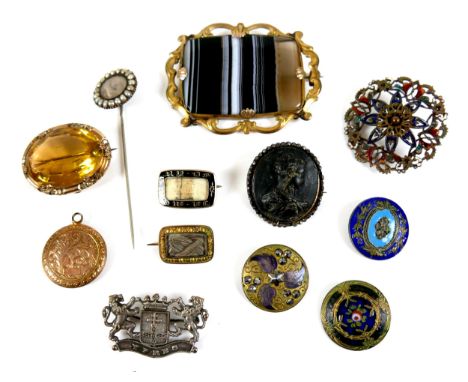 A group of twelve brooches, buttons and a stick pin, 18th century and later, including a Roman bust cameo brooch, 3.0cm, a br