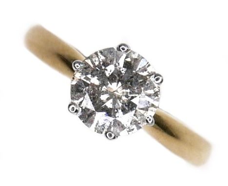 An 18ct gold diamond solitaire ring, the round brilliant cut stone, 7.1mm diameter, 1.39ct, in a raised six claw setting, siz