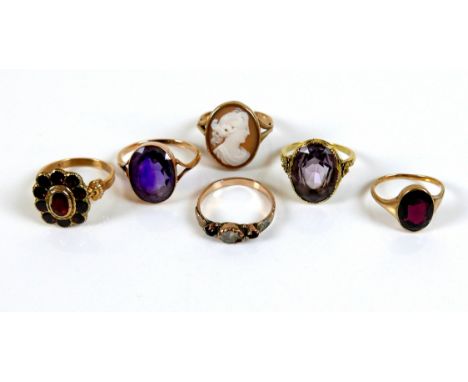 A group of five 9ct gold rings, including one set with a cameo, 19mm high, size T, two set with oval cut amethysts, sizes Q a