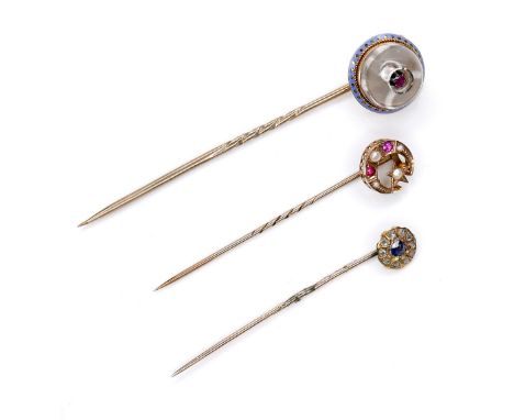 A group of three Victorian stick pins, comprising a 9ct gold pin, with crescent moon and five pointed star design, set with p