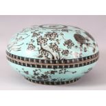 A LARGE CHINESE TURQUOISE GROUND CIRCULAR BOX AND COVER, the exterior decorated with flowers, the