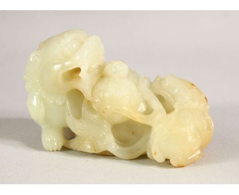 A GOOD CHINESE CARVED JADE FIGURE OF TWO DOGS OF FO, 9cm long.