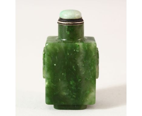 AN 18TH / 19TH CENTURY CHINESE CARVED GREEN JADE SNUFF BOTTLE, carved with twin handle and rings, with a jadeite stopper and 