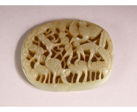 A CHINESE CARVED GREEN JADE PENDANT OF CRANE - carved in openwork with crane and foliage, 6.2cm