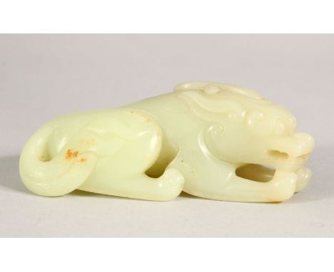 A CHINESE CARVED JADE CROUCHING LION, 9cm long.