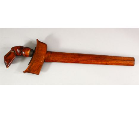 AN INDONESIAN KRIS WITH DAMASCUS BLADE, with carved wood hilt and plain wood scabbard, blade length 30cm, overall length (in 