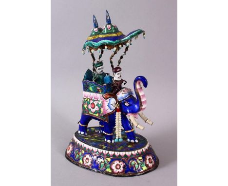 A 19TH / 20TH CENTURY INDIAN SILVER &amp; ENAMEL MODEL OF AN ELEPHANT AND FIGURES, the elephant carrying two figures, with fl