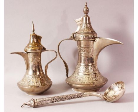 TWO INDIAN DALLAH WHITE METAL COFFEE POTS &amp; LADLE - The ladle possibly with a silver handle, 30cm , the coffee pots 28cm 