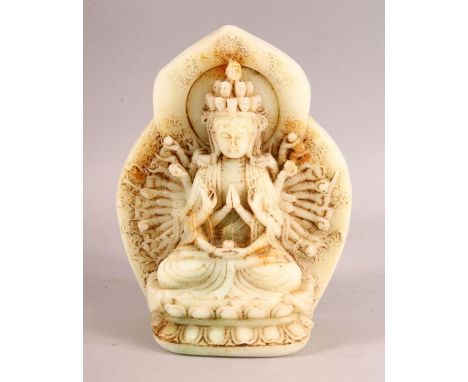 A LARGE CHINESE CARVED JADE FIGURE OF THOUSAND ARM GUANYIN DEITY, seated upon a lotus base with multi arms and halo, 22cm hig
