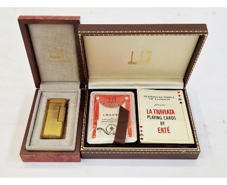 Dunhill gilt metal lighter, engine-turned, in figured wood case, 6.5cm high, and set of Dunhill La Traviata playing cards by 