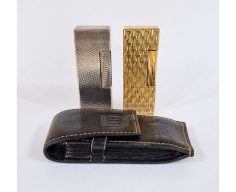 Dunhill gilt lighter, rectangular with engine-turned decoration, no.161283, 6.5cm high with Dunhill leather pouch, and a Dunh
