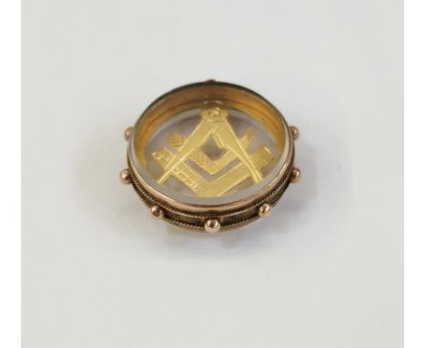 Early 20th century 9ct gold Masonic square and compass pendant&nbsp;in a round glazed mount, 5.1g&nbsp;
