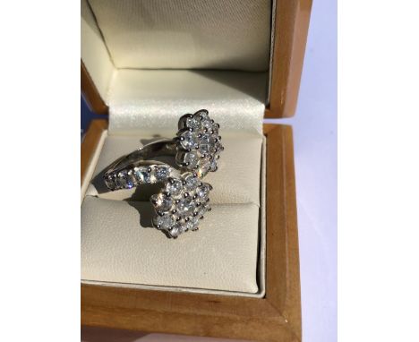 A DOUBLE CLUSTER TOI ET MOI DIAMOND RING WITH DIAMOND SET SHOULDERS. UNHALLMARKED, ASSESSED AS PLATINUM. FINGER SIZE K 1/2. W