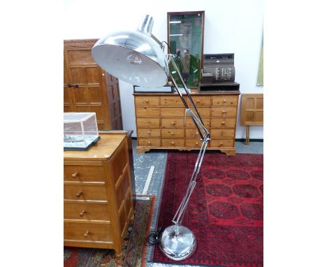 A GIANT CHROME FLOOR STANDING ANGLE POISE LAMP TOGETHER WITH A ALUMINIUM CEILING SHADE.