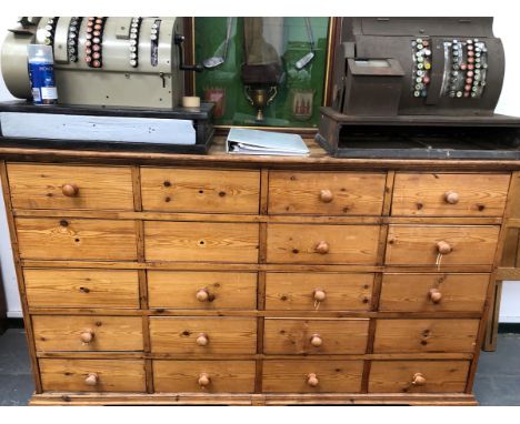 A 19th C. AND LATER PINE DRESSER BASE WITH FOUR BANKS OF FIVE DRAWERS ABOVE BRACKET FEET.   W 166 x D 64 x H 104cms.