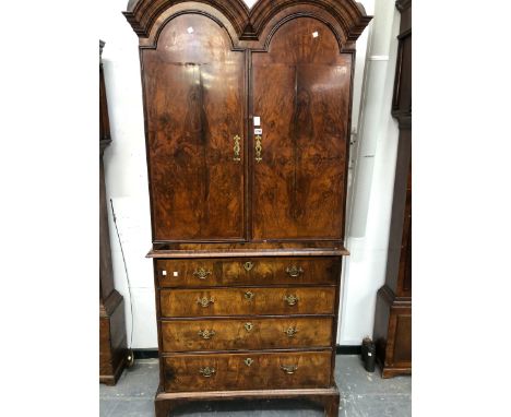 AN 18th C. WALNUT DOUBLE DOMED SECRETAIRE CHEST, THE TOP WITH TWO PANELLED DOORS ABOVE THE DRAW OUT SECRETAIRE DRAWER AND THR