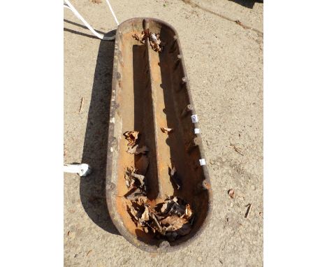 A CAST IRON TROUGH.