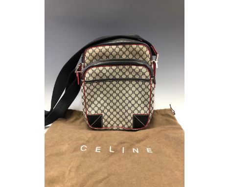 A CROSS BODY CELINE BAG WITH ADJUSTABLE STRAP. W 20 x H 26 cms. 