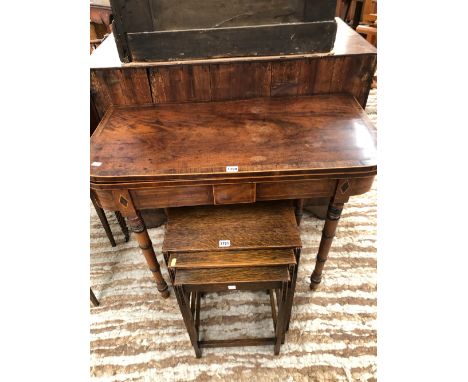 A GEORGE III ROSEWOOD CROSS BANDED MAHOGANY GAMES TABLE, THE TOP SWIVELLING OPEN TO REVEAL RED BAIZE ABOVE THE RING TURNED CY