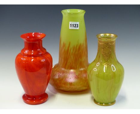 THREE EARLY 20th C. GLASS VASES AND A FROSTED VASELINE GLASS LIGHT SHADE, THE RED AND GILT VASES.   H 21cms. THE FLAME STREAK