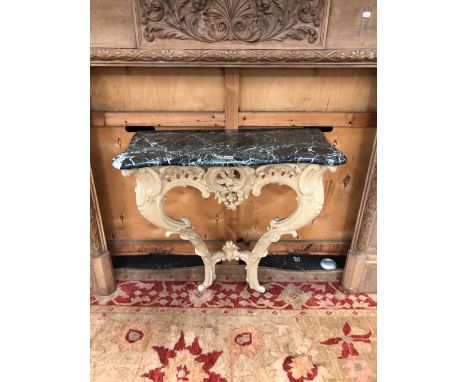 A 19th C. GREEN MARBLE TOPPED FRENCH CONSOLE TABLE, THE ROCOCO CARVED APRON ABOVE TWO CABRIOLE LEGS.   W 82 x D 39 x H 82cms.