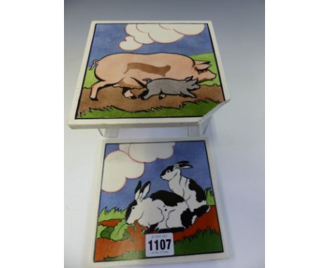 TWO 1920S CARTER POOLE POTTERY TILES FROM E E STICKLANDS FARMYARD SERIES DEPICTING RABBITS AND PIGS