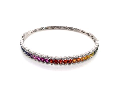 AN 18ct WHITE GOLD HALLMARKED RAINBOW SAPPHIRE AND DIAMOND HINGED BANGLE. APPROX SAPPHIRE CARAT WEIGHT AS STATED 5.50cts, APP