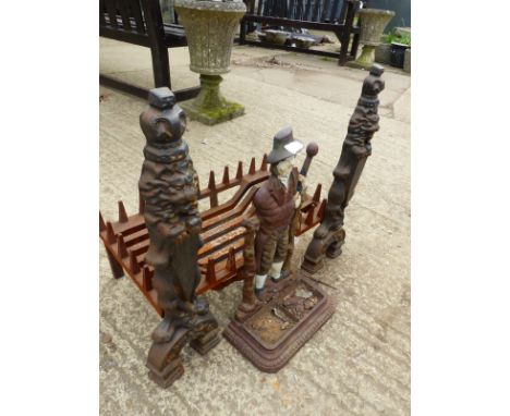 A CAST IRON FIRE GRATE WITH DOGS AND A STICK STAND