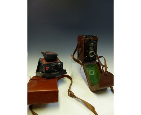 A ROLLEIFLEX TLR CAMERA, A POLAROID SX-70 LAND CAMERA IN ORIGINAL LEATHER POUCH, A KODAK VINTAGE FOLDING CAMERA, A WESTON LIG