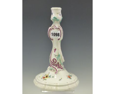 A DOT PERIOD MEISSEN PORCELAIN CANDLESTICK PAINTED WITH SPRIGS OF FLOWERS, THE ROCAILLE DETAILS OF THE COLUMN DETAILED IN MAU