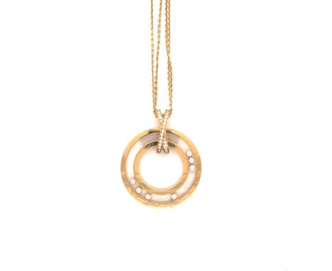 AN 18ct HALLMARKED GOLD HAPPY DIAMONDS, FLOATING DIAMONDS CHOPARD PENDANT. SERIAL NUMBER 796252 314487