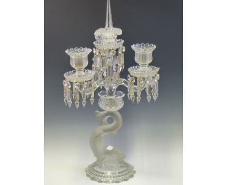 A BACCARAT THREE LIGHT LUSTRE CANDELABRUM, THE CLEAR GLASS WITH FROSTED DETAILS, THE DOLPHIN COLUMN ON PETAL EDGED CIRCULAR F