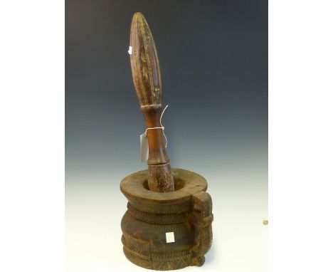 A NORTH AFRICAN INLAID WOODEN MORTAR AND PESTLE, THE RIM INLAID WITH TRIANGLES OF MOTHER OF PEARL TOGETHER WITH ANOTHER WOODE