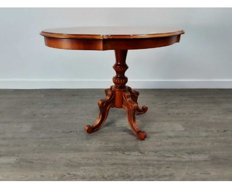 YEW WOOD REPRODUCTION OVAL OCCASIONAL TABLE on a single pillar support and quadripartite base90cm wide