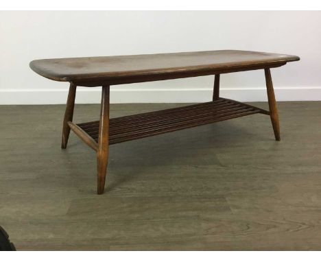 ERCOL COFFEE TABLE MID CENTURY  with undertier36cm high, 104cm wide, 45cm deep Reasonable overall condition,&nbsp; all joints