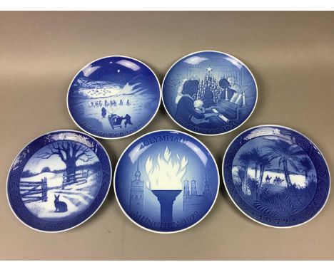 FIVE ROYAL COPENHAGEN PLATES AND A CRUCIFIX WALL PLAQUE depicting Christmas and other scenes