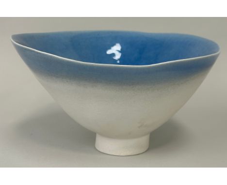 AFTER LUCIE RIE: A LARGE CERAMIC BLUE AND WHITE GLAZED FOOTED BOWL, 28cm x 17cm 