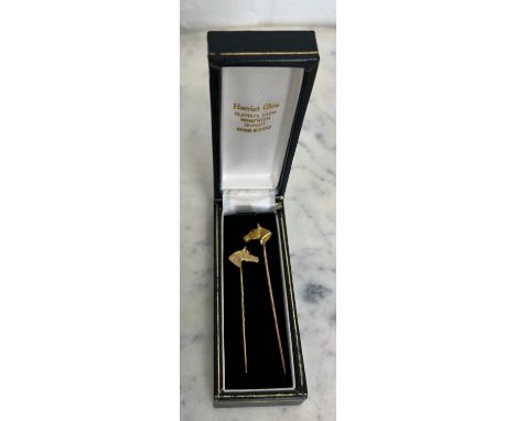 A MATCHED PAIR OF TWO HORSE HEAD GOLD BROOCHES WITH SAPPHIRE AND RUBY EYES (2)Weight 5.4gms 